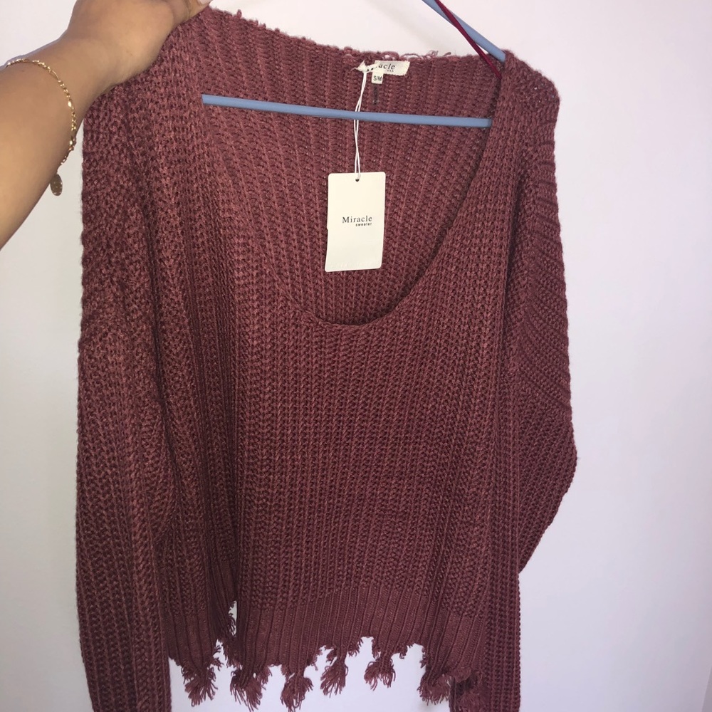 An off the shoulder sweater